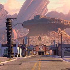 an alien city with mountains in the background