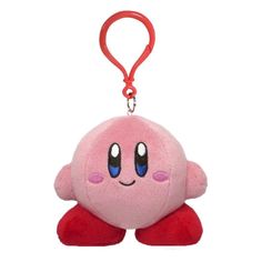 a pink stuffed animal with blue eyes and red legs is hanging from a red keychain