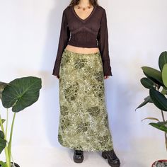 "Green floral maxi skirt Stunning green maxi skirt with different floral patterns all over & multiple tones. Lightweight fabric, perfect for warmer seasons. Has slits on each side seam. Has an elasticized waistband on the back. Made in the 90s or early 2000s. The tags were removed, otherwise perfect condition Measurements are taken flat Full measurements provided Size: medium to large *pinned to fit model* Waist: 32\"-40\" Hip: 46\" Length: 38\" Fabric content: N/A, likely polyester" Green Floral Maxi Skirt, Green Floral Skirt Outfit, 90s Maxi Skirt, Green Silk Skirt, Floral Skirt Outfits, Maxi Rock, Green Floral Skirt, Green Maxi Skirt, Silk Midi Skirt