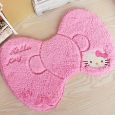 a pink hello kitty rug on the floor