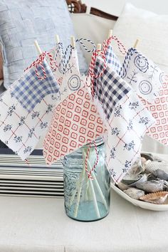 some paper umbrellas sitting on top of a table next to a bowl and plate