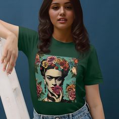 Mexican Frida Khalo Shirt, Mexican Women T-shirt, Christmas Gift for her, Mexican Pride Shirt, Camiseta Mexicana, Regalo para Mujer The unisex soft-style t-shirt puts a new spin on casual comfort. Made from very soft materials, this tee is 100% cotton for solid colors. Heather colors and sports grey include polyester. The shoulders have twill tape for improved durability. There are no side seams. The collar is made with ribbed knitting to prevent curling damage.  ✅Made with 100% ring-spun cotton, a lightweight fabric (4.5 oz/yd² (153 g/m this unisex t-shirt feels like a bliss to wear all year round.  ✅ The classic fit with the crew neckline deliver a clean, versatile style that can match any occasion, whether it's formal or semi-formal.  ✅ All shirts feature a pearlized, tear-away label fo Green T-shirt With Funny Print As Gift, Printed Crew Neck Tops For Gifts, Printed Crew Neck Top As Gift, Funny Print Short Sleeve Tops For Gift, Green Graphic Print Top For Gift, Green Graphic Print Top As Gift, Sublimation Print Short Sleeve Tops As A Gift, Gift Sublimation Print Short Sleeve Tops, Printed Short Sleeve T-shirt Gift