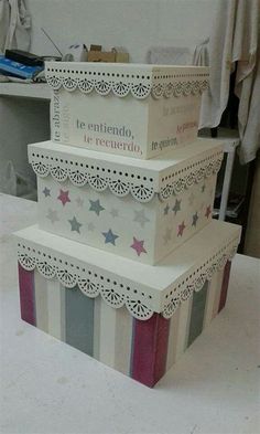 three tiered boxes stacked on top of each other with stars and stripes painted on them