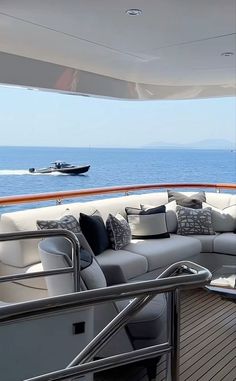 there is a couch on the deck of a boat