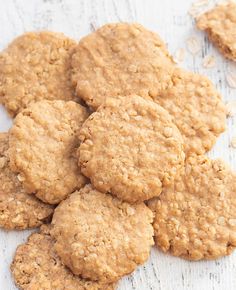 several oatmeal cookies sitting on top of a piece of paper next to each other