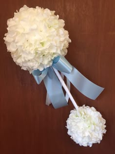 a bouquet of white hydrangeas and two lollipops