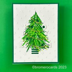 a card with a green christmas tree on it