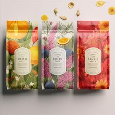 three bags of tea with flowers and oranges on the top one has a label that says beryldale