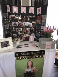 a table with pictures and flowers on it