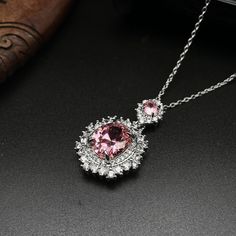 ✰ This delicate lab-created pink gemstone pendant is perfect for people who want to achieve a brilliant and splendid look ✰  Not only for everyday wear, this pink minimalist necklace is also great for weddings and also as a bridesmaid ring ✰ This pink gem necklace with halo is a very special gift for birthday, Mother's Day, bridesmaids, Valentine's Day and more  ✰ Comes with an exquisite gift box We also offer the ring and earring from the same collection:  https://www.etsy.com/listing/1208056812/pink-oval-zircon-ring-with-halo-oval https://www.etsy.com/listing/1222001683/pink-drop-earring-with-halo-oval-zircon Materials: Environmentally-friendly brass Quantity: 1 Pendant with chain Main Gemstone Size: 0.47 x 0.4 in ----♛ PRODUCTION & SHIPPING ♛ --- ✰Multiple items purchased in one payment Pink Gem Necklace, Pink Gemstone Necklace, Bridesmaid Ring, Pink Drop Earrings, Pink Minimalist, Pink Zircon, Oval Pendant Necklace, Bridesmaid Rings, Zircon Necklace