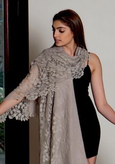 Crafted from luxuriously fine wool, this unique and feminine natural melange scarf wraps you in warmth while exuding sophistication. With its refined earthy tones and tonal-colored lace detailing, it's a must-have addition to your wardrobe. Can be worn year round offering comfort and a touch of graceful allure. Elegant Lace Shawl For Winter, Elegant Winter Lace Shawl, Elegant Beige Pashmina Shawl For Fall, Elegant Beige Wrap For Fall, Elegant Beige Wraps For Fall, Elegant Cashmere Shawl Scarf, Elegant Beige Scarf Wrap, Elegant Beige Wrap Scarf, Elegant Lace Shawl Scarves