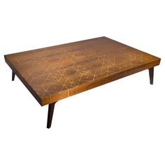 a wooden table with geometric designs on it