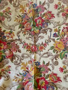 the fabric is very colorful and has many flowers on it