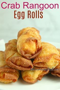 crab rangoon egg rolls on a white plate with text overlay that reads crab rangoon egg rolls