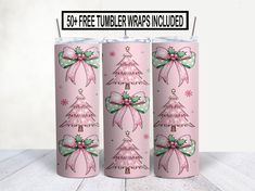 three pink christmas candles with bows on them and the words free tumbler wrap included