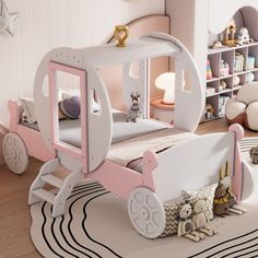 a child's bedroom with a pink and white carriage bed