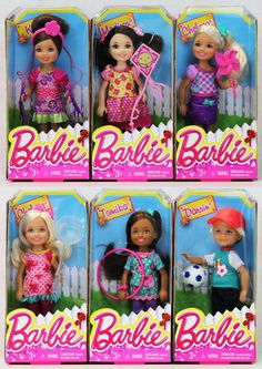 four barbie dolls are shown in their boxes