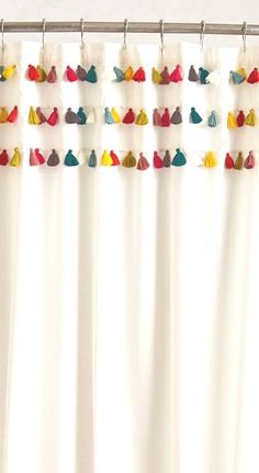 a curtain with tassels hanging from it