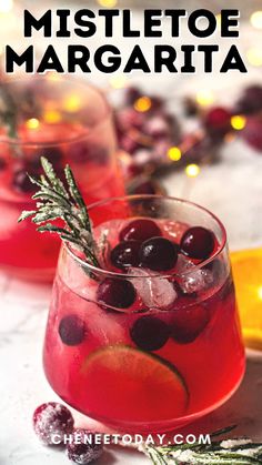 two glasses filled with cranberry mistlet margarita