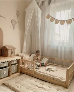 a little boy sitting in his bed reading a book