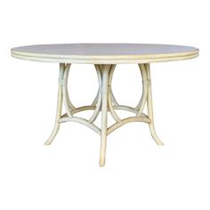 a white table with an oval top and two curved legs, on a white background