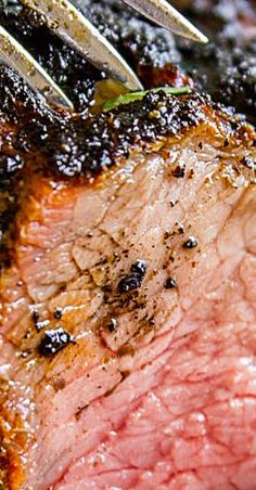 a close up view of some meat on a grill