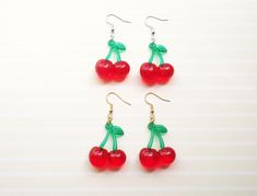 A pair of cute cherry earrings ♡ Choose between regular or iridescent in gold or silver Each charm is 3cm Comes with rubber earring backs Cheap Cute Cherry Colored Earrings, Trendy Cherry Earrings At Affordable Price, Handmade Cherry Cute Earrings, Cheap Trendy Cherry-colored Earrings, Cheap Cherry Earrings, Coquette Y2k, Harajuku Decora, Aesthetic Earrings, Kawaii Earrings