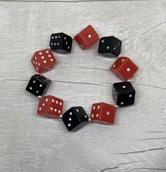 Black and Red Acrylic Dice Beaded Elasticated Bracelet with Small Silver plated Alloy beads in between. Dice Beads measure approx 12 mm. Bracelet measures approx 20 cm (8 inches) Recommended that the bracelet where possible to be rolled to fit over hand rather than over stretching the elastic. Any questions please ask  Thank you for looking Black And Red Acrylic, Tattoo Pin Up, Kitsch Fashion, Goth Tattoo, Pin Up Tattoos, Kandi Bracelets, Red Jewelry, Black Accessories, Kitsch