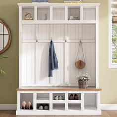 a coat rack with shoes and towels hanging on the wall next to a potted plant