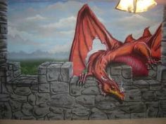 a painting of a red dragon on a stone wall next to a light fixture in a room