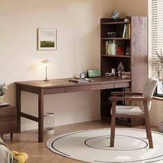 a room with a desk, chair and bookcase in it on the floor next to a window