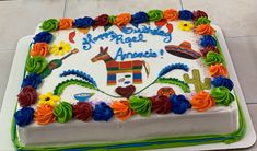 a birthday cake with colorful frosting and decorations