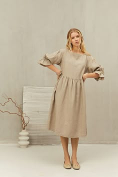 This smock dress is perfect for all occasions and seasons.   Made from natural linen with a loose oversized fit and slightly puffed sleeves, it will add a touch of simple elegance to your look. The dress is perfect for casual autumn days, office, summer holiday adventures, beach wear and birthday, anniversary and wedding celebrations. It is also perfect for pregnancy time. Celebrate the femininity with sustainable LGlinen creations ITEM DETAILS: - Loose straight shape - Long sleeves - Two sides Linen Ruffle Dress For Daywear, Linen Daywear Dress With Ruffles, Linen Ruffle Dress For Brunch, Knee-length Ruffled Linen Dress For Spring, Spring Linen Dress With Gathered Sleeves, Knee-length Linen Midi Dress With Ruffles, Beige Linen Dress With Ruffles For Spring, Spring Beige Linen Dress With Ruffles, Casual Linen Dress With Gathered Sleeves