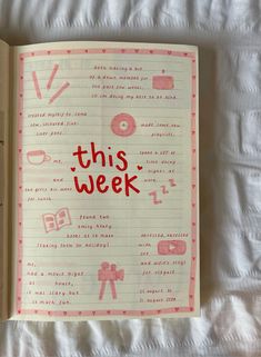 an open notebook with the words this week written in red and pink ink on it