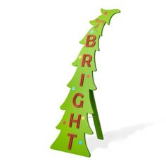 a green wooden sign that says bright with a christmas tree in the bottom right corner