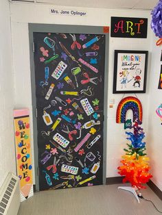 a classroom door decorated with school supplies and decorations