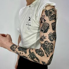 a man with many tattoos on his arm