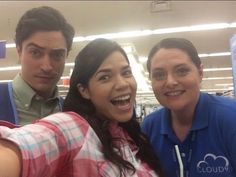 three people taking a selfie in a store