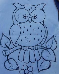 a drawing of an owl sitting on top of a piece of paper with numbers written in it