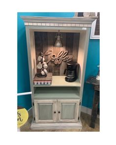 an old china cabinet with the word coffee on it