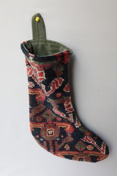 a small stocking hanging on the wall