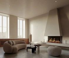 a living room with a fire place in the center and two couches on either side