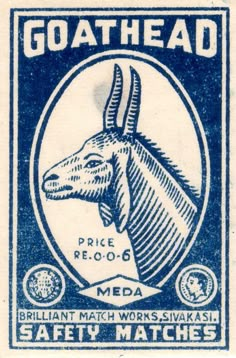 a blue and white stamp with an image of a goat head on it's side