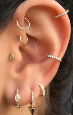 three different types of ear piercings