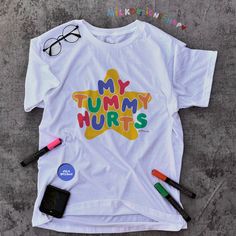 My tummy hurts tee is the perfect funny shirt to wear as your next meme shirt. Inspired by clowncore clothing and kidcore clothes - the playful colors and original hand written lettering will surely bring colors to your days. This funny meme shirt is a perfect addition to your kidcore tee collection or as your daily clown shirt. This clowncore shirt is also the perfect funny gift for her, gift for him or anyone you know who suffers from IBS, survived a diarrhea or for anyone you love who always get tummy aches as these oddly specific meme shirts are unisex. Available in XS, S, M, L, XL, 2XL, & 3XL ✨ 100% ⭐️ PREMIUM ⭐️ Airlume combed and ringspun cotton  ✨ Light fabric ✨ Retail Unisex fit ✨ Tear away label ✨ Runs true to size ✨ Original Lettering Font & Design by MilkDesigns ‼️ Print Size w Kidcore Clothes, My Tummy Hurts, Tummy Hurts, Tee Shirt Outfit, Meme Shirts