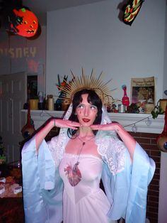 a woman dressed in costume poses for the camera