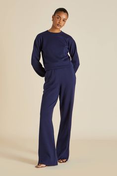 OvH’s sophisticated silhouette arrives in chic navy, for the most luxurious tracksuit of the season. Lending itself to elevated styling, this knitted luxury tracksuit redefines your downtime. ​ Product Details Luxury navy silk-cashmere jumper and wide leg trouser Elasticated cuffs and waistband 85% Silk, 15% Cashmere Product code SC0029 Materials and Care Olivia von Halle products are made using the finest natural materials This item is made from 85% silk and 15% cashmere Hand wash in cool water Luxury Tracksuit, Cashmere Loungewear, Grey Tracksuit, Luxe Loungewear, Olivia Von Halle, Loungewear Luxury, Cashmere Jumper, Tracksuit Set, Halle