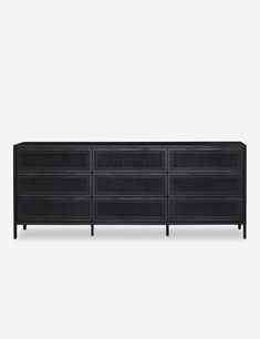 the sideboard is made from black rattan and has four drawers on each side