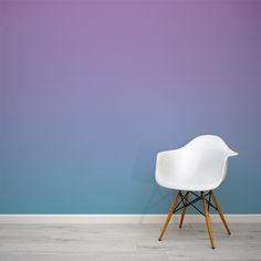 a white chair against a blue and purple wall