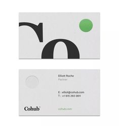 two business cards with black and green dots on them